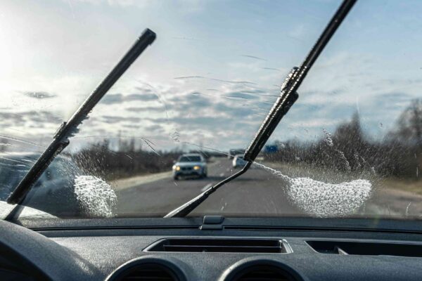 Car wipers clean windshields when driving sunny weather 1